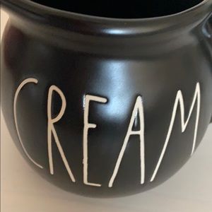 Rae Dunn black ceramic pitcher with “cream” label